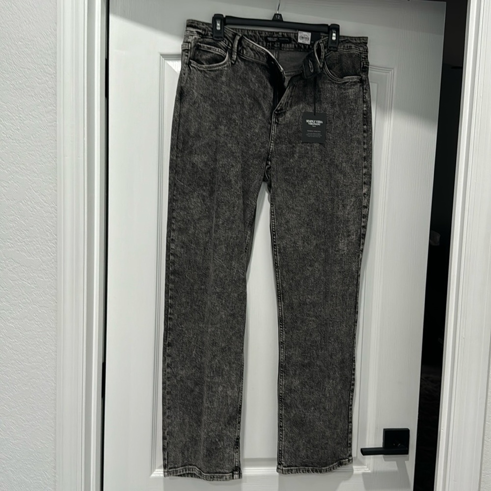 Acid wash black denim relaxed straight leg mid rise.